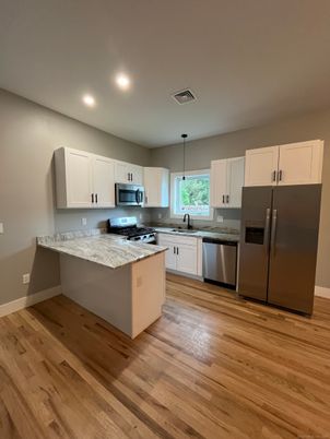 Interior, Kitchen, Pendant Lights, Recessed Lighting, Stainless Steel Appliances, Wood Texture Flooring