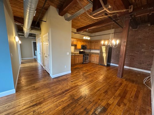 Chandelier, Empty room, Interior, Kitchen, Pendant Lights, Stainless Steel Appliances, Stone Walls, Wooden Beams, Wooden Ceilings, Wood Texture Flooring