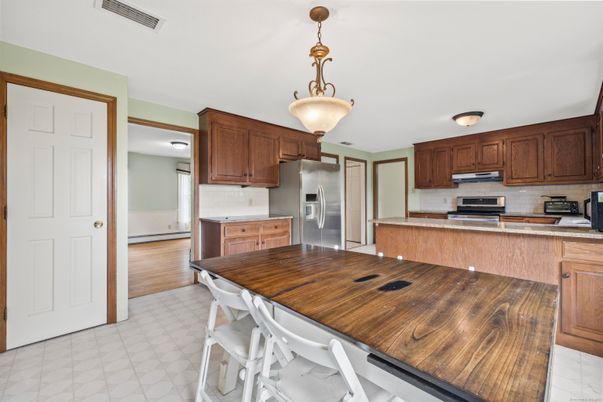 Dining room, Interior, Kitchen, Pendant Lights, Stainless Steel Appliances, Wood Texture Flooring
