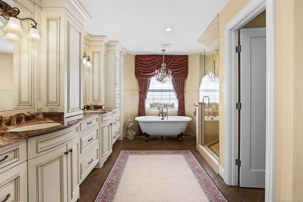 Bathroom, Chandelier, Dual Sink Vanities, Free Standing Baths, Interior, Recessed Lighting, Wood Texture Flooring