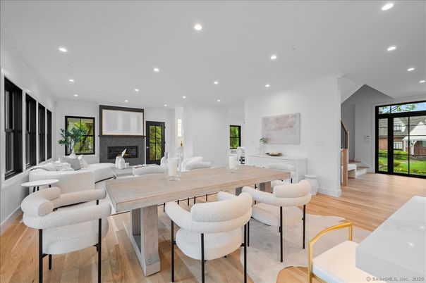 Dining room, Fireplace, Interior, Living room, Recessed Lighting, Wood Texture Flooring