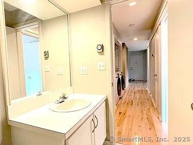 Bathroom, Interior, Recessed Lighting, Washer, Wood Texture Flooring