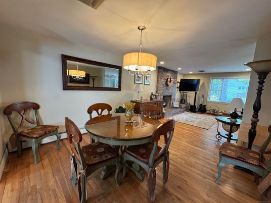 Chandelier, Dining room, Fireplace, Interior, Living room, Recessed Lighting, Wood Texture Flooring