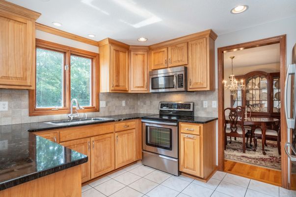 Chandelier, Dining room, Interior, Kitchen, Recessed Lighting, Stainless Steel Appliances, Wood Texture Flooring