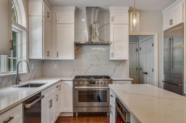 Interior, Kitchen, Marble Walls, Pendant Lights, Stainless Steel Appliances, Wood Texture Flooring