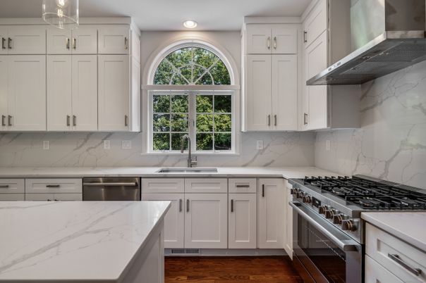 Interior, Kitchen, Marble Walls, Recessed Lighting, Stainless Steel Appliances, Wood Texture Flooring