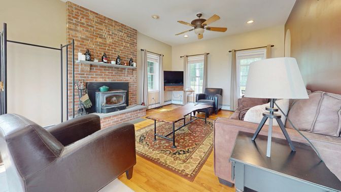 Fireplace, Interior, Living room, Recessed Lighting, Stone Walls, Wood Texture Flooring