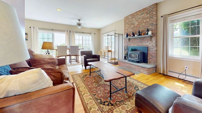 Dining room, Fireplace, Interior, Living room, Recessed Lighting, Stone Walls, Wood Texture Flooring