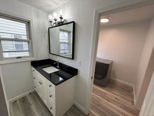 Bathroom, Dual Sink Vanities, Interior, Recessed Lighting, Washer, Wood Texture Flooring