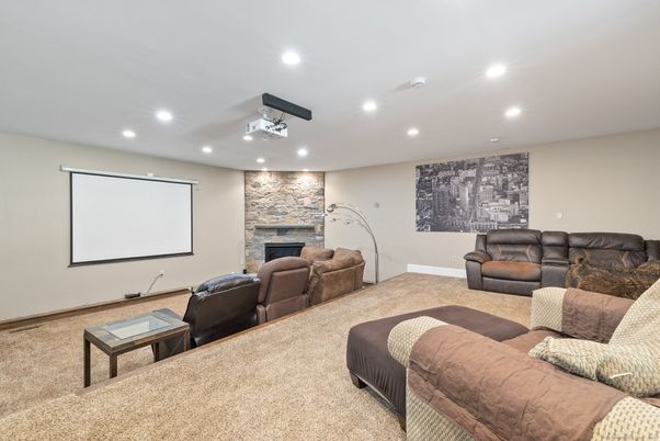 Fireplace, Interior, Living room, Projection Screen, Recessed Lighting, Stone Walls