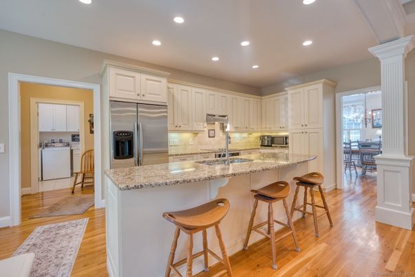 Dining room, Interior, Kitchen, Recessed Lighting, Stainless Steel Appliances, Wood Texture Flooring