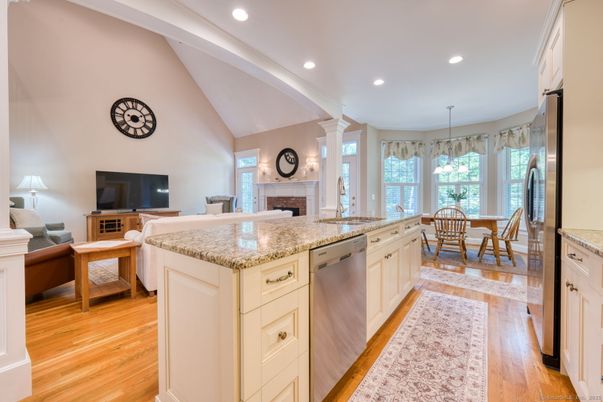 Dining room, Fireplace, Interior, Kitchen, Recessed Lighting, Wood Texture Flooring