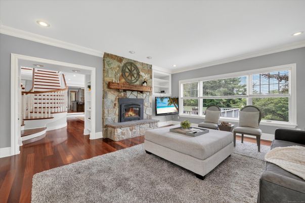 Fireplace, Interior, Living room, Recessed Lighting, Stone Walls, Wood Texture Flooring