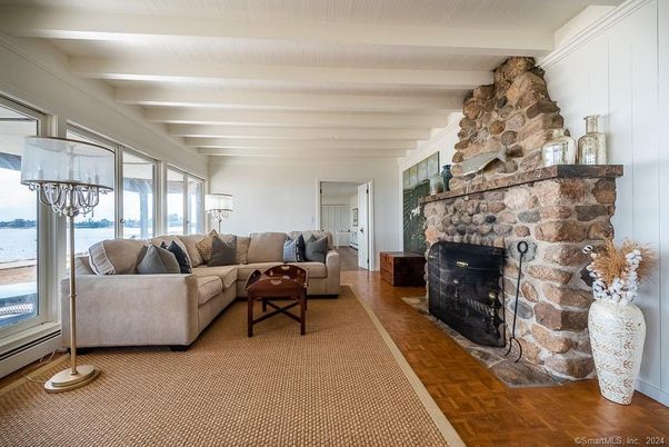 Chandelier, Fireplace, Interior, Living room, Stone Walls, Water, Wood Texture Flooring