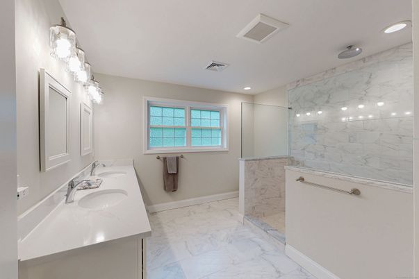 Bathroom, Dual Sink Vanities, Glass Shower, Interior, Marble, Marble Walls, Recessed Lighting