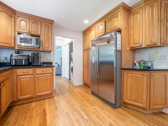 Interior, Kitchen, Recessed Lighting, Washer, Wood Texture Flooring