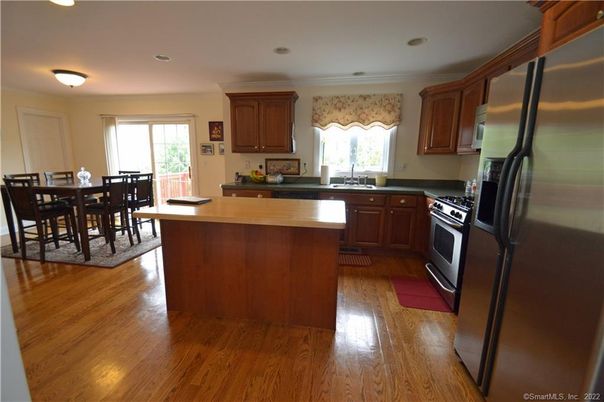Dining room, Interior, Kitchen, Recessed Lighting, Stainless Steel Appliances, Wood Texture Flooring