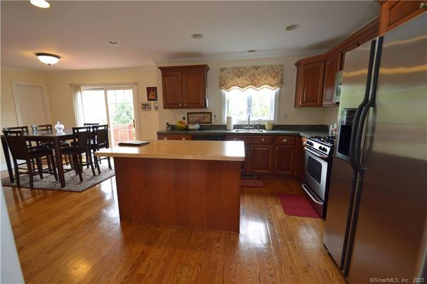 Dining room, Interior, Kitchen, Recessed Lighting, Stainless Steel Appliances, Wood Texture Flooring