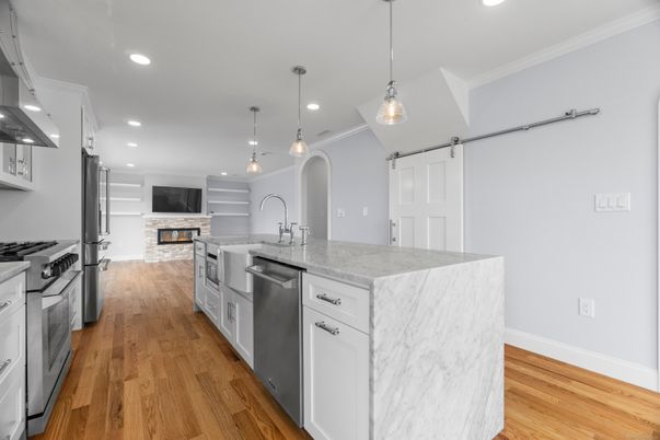 Fireplace, Interior, Kitchen, Pendant Lights, Recessed Lighting, Stainless Steel Appliances, Wood Texture Flooring