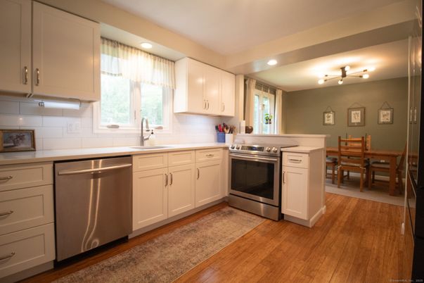 Dining room, Interior, Kitchen, Recessed Lighting, Stainless Steel Appliances, Wood Texture Flooring