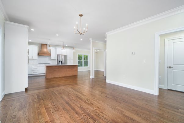 Chandelier, Empty room, Interior, Kitchen, Pendant Lights, Recessed Lighting, Stainless Steel Appliances, Wood Texture Flooring