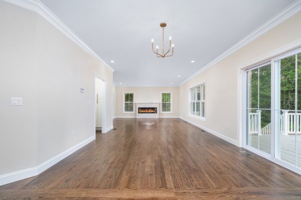 Chandelier, Empty room, Fireplace, Interior, Pendant Lights, Recessed Lighting, Wood Texture Flooring