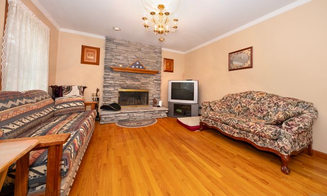 Chandelier, Fireplace, Interior, Living room, Stone Walls, Wood Texture Flooring