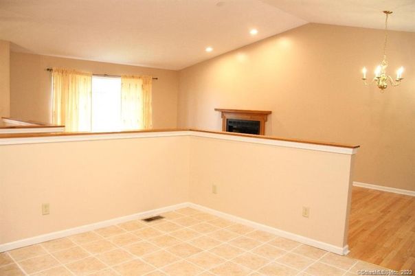 Chandelier, Empty room, Fireplace, Interior, Recessed Lighting, Wood Texture Flooring