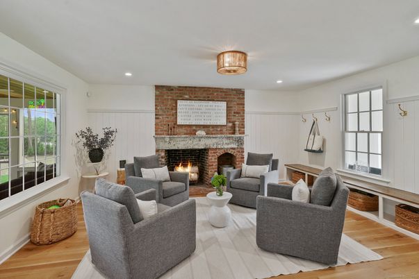 Fireplace, Interior, Living room, Recessed Lighting, Stone Walls, Wood Texture Flooring
