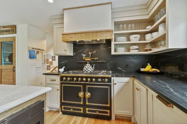 Interior, Kitchen, Marble Walls, Recessed Lighting, Stainless Steel Appliances, Wood Texture Flooring