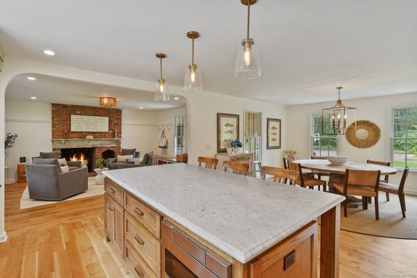 Dining room, Fireplace, Interior, Living room, Pendant Lights, Recessed Lighting, Stone Walls, Wood Texture Flooring