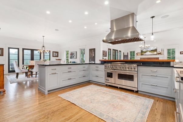 Chandelier, Dining room, Interior, Kitchen, Pendant Lights, Recessed Lighting, Stainless Steel Appliances, Wood Texture Flooring