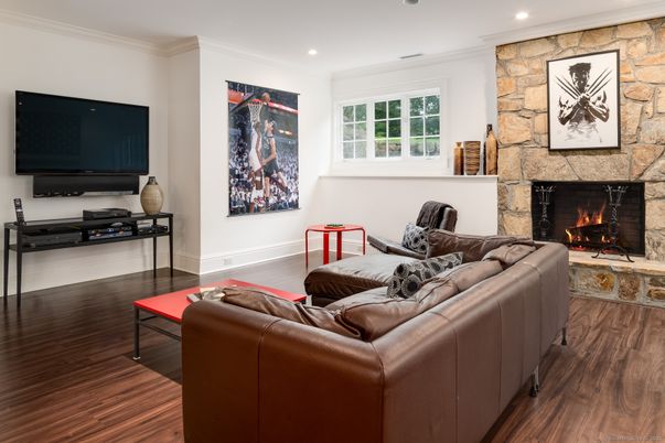 Fireplace, Interior, Living room, Recessed Lighting, Stone Walls, Wood Texture Flooring