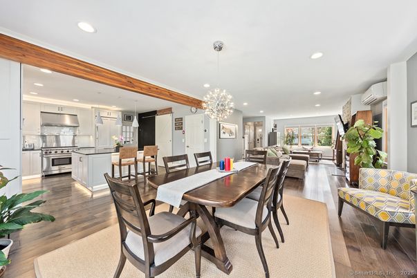 Chandelier, Dining room, Interior, Kitchen, Living room, Pendant Lights, Recessed Lighting, Stainless Steel Appliances, Wooden Beams, Wood Texture Flooring