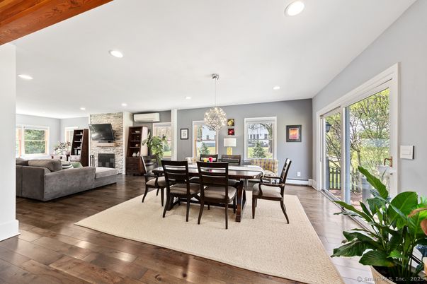 Chandelier, Dining room, Fireplace, Interior, Living room, Pendant Lights, Recessed Lighting, Stone Walls, Wood Texture Flooring