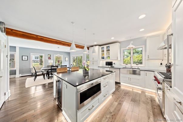 Dining room, Interior, Kitchen, Pendant Lights, Recessed Lighting, Stainless Steel Appliances, Wood Texture Flooring