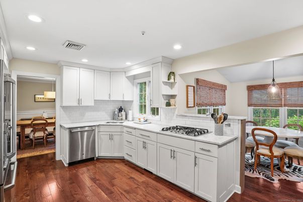 Dining room, Interior, Kitchen, Pendant Lights, Recessed Lighting, Stainless Steel Appliances, Wood Texture Flooring