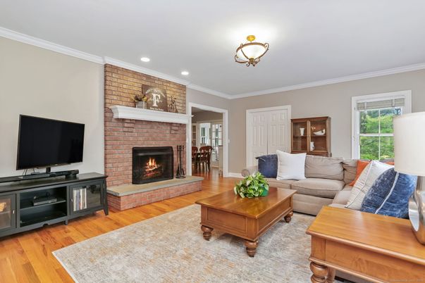 Fireplace, Interior, Living room, Recessed Lighting, Stone Walls, Wood Texture Flooring