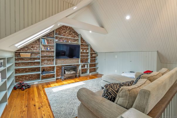 Fireplace, Interior, Living room, Recessed Lighting, Stone Walls, Wood Texture Flooring