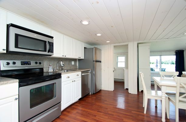Dining room, Interior, Kitchen, Recessed Lighting, Stainless Steel Appliances, Wood Texture Flooring