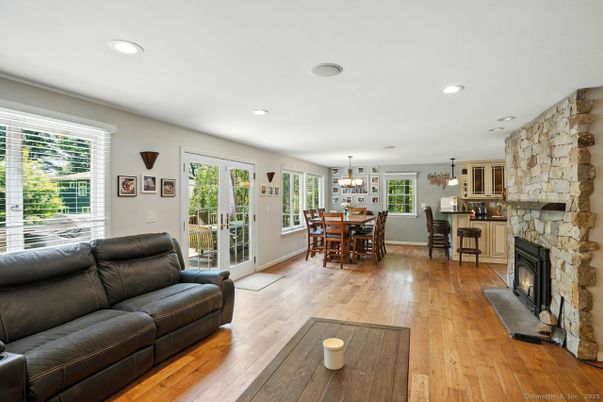 Chandelier, Dining room, Fireplace, Interior, Living room, Recessed Lighting, Stone Walls, Wood Texture Flooring