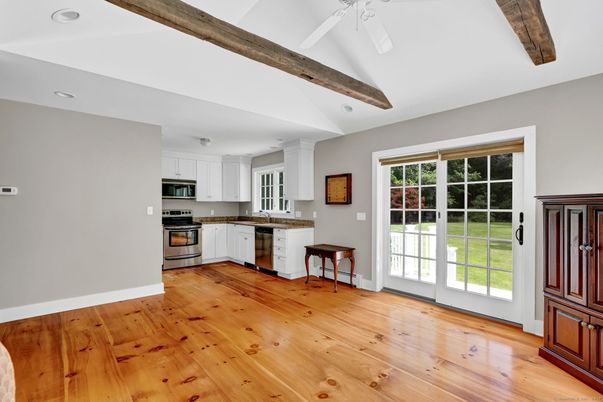 Empty room, Interior, Kitchen, Recessed Lighting, Stainless Steel Appliances, Wooden Beams, Wood Texture Flooring