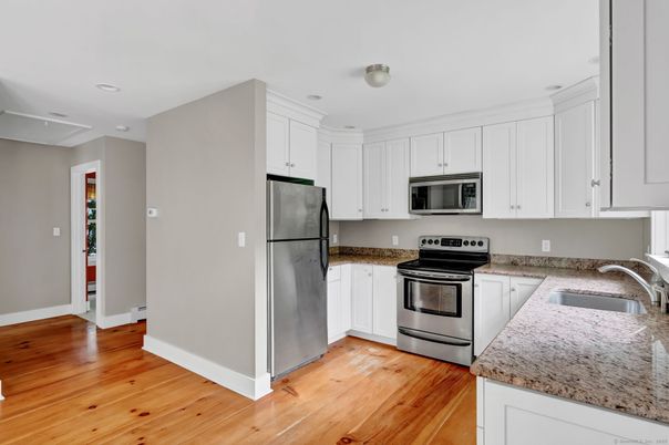 Interior, Kitchen, Recessed Lighting, Stainless Steel Appliances, Wood Texture Flooring