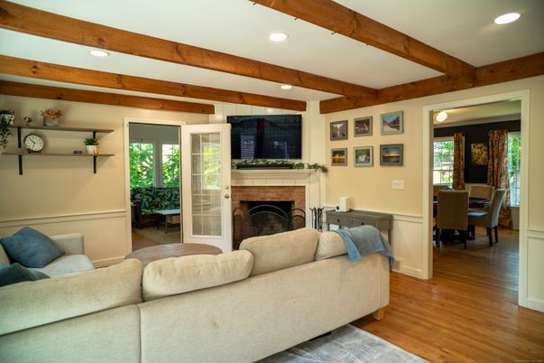 Dining room, Fireplace, Interior, Living room, Recessed Lighting, Wooden Beams, Wood Texture Flooring
