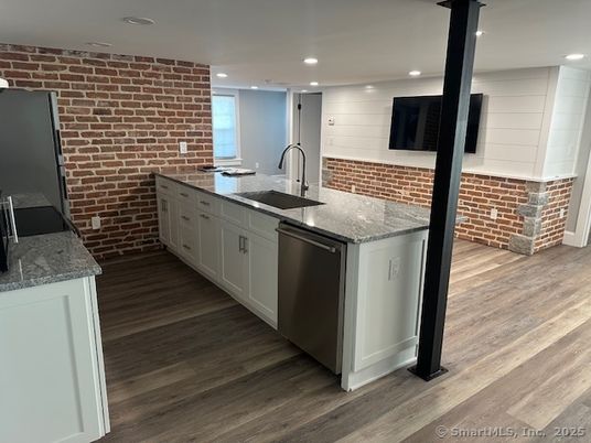 Interior, Kitchen, Recessed Lighting, Stainless Steel Appliances, Stone Walls, Wood Texture Flooring