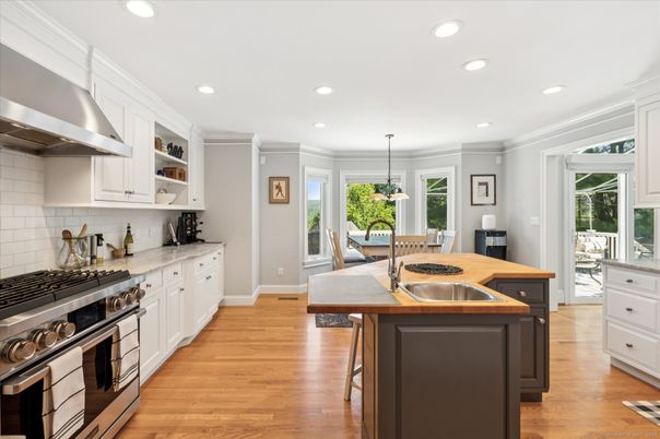 Dining room, Interior, Kitchen, Pendant Lights, Recessed Lighting, Stainless Steel Appliances, Wood Texture Flooring