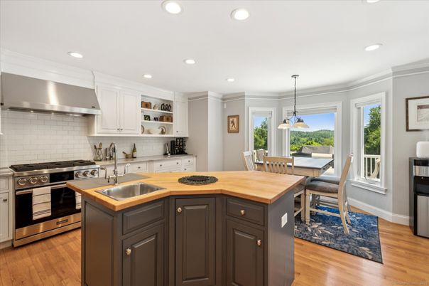 Dining room, Interior, Kitchen, Pendant Lights, Recessed Lighting, Stainless Steel Appliances, Wood Texture Flooring