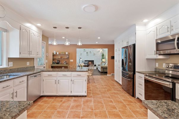 Fireplace, Interior, Kitchen, Living room, Pendant Lights, Recessed Lighting, Stainless Steel Appliances, Stone Walls