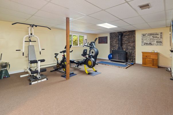 Fireplace, Fitness Equipment, Interior, Recessed Lighting, Stone Walls