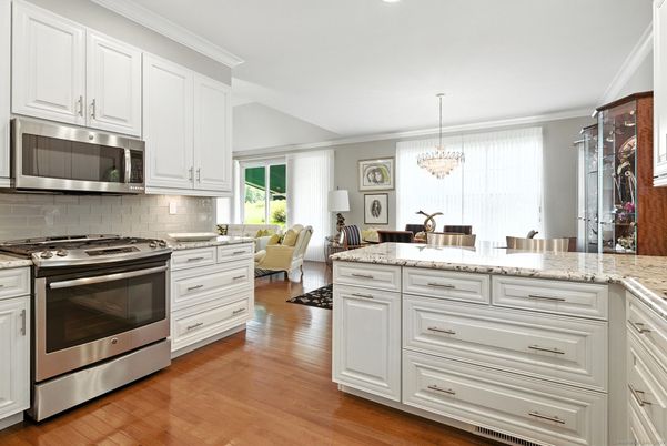 Chandelier, Dining room, Interior, Kitchen, Living room, Stainless Steel Appliances, Wood Texture Flooring